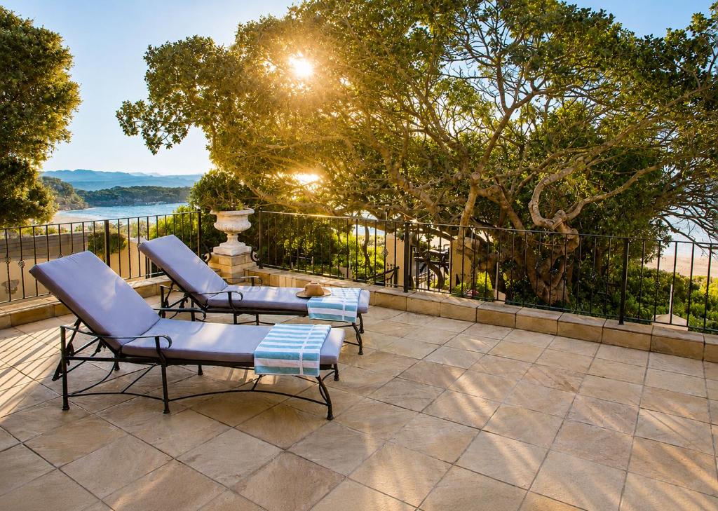 Sunlit terrace loungers at Tremezzo Plett