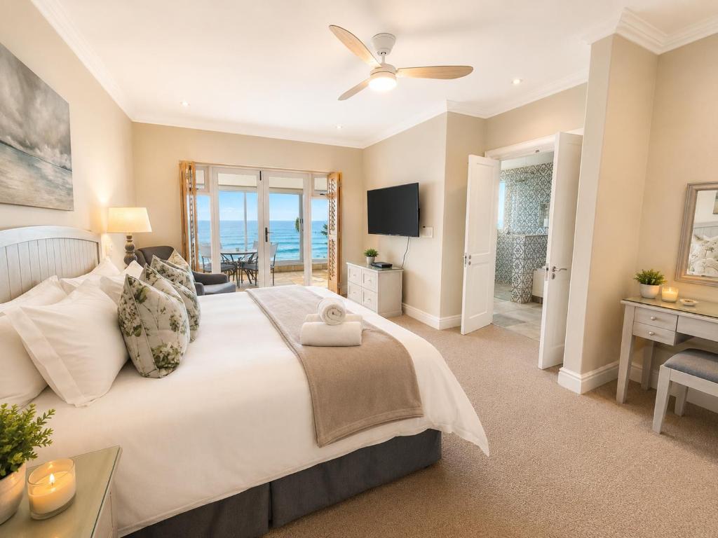 Bedroom with sea-facing doors at Tremezzo Plett