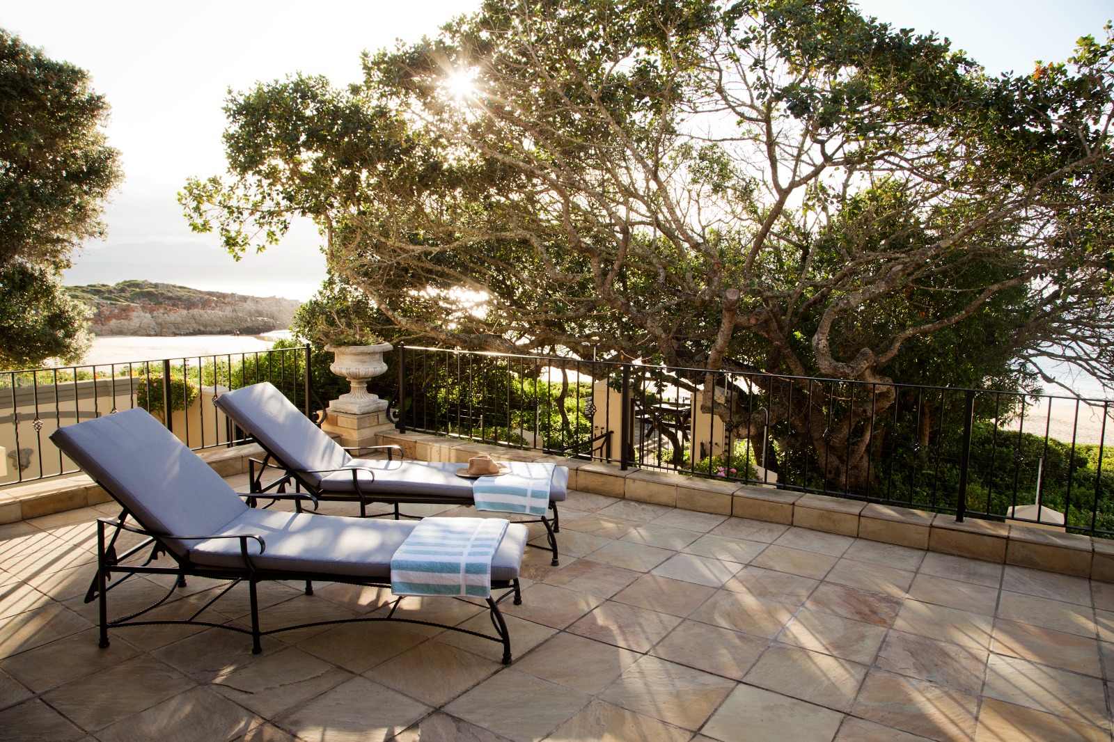 Sunlit terrace loungers looking toward Central Beach
