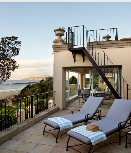 Sun loungers on the terrace with ocean views
